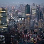 nighttime city buildings viewed from above, illustrating continuous systems and ongoing operational responsibility