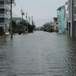 Flooded residential street in Nigeria showing water accumulation and drainage challenges in urban housing areas