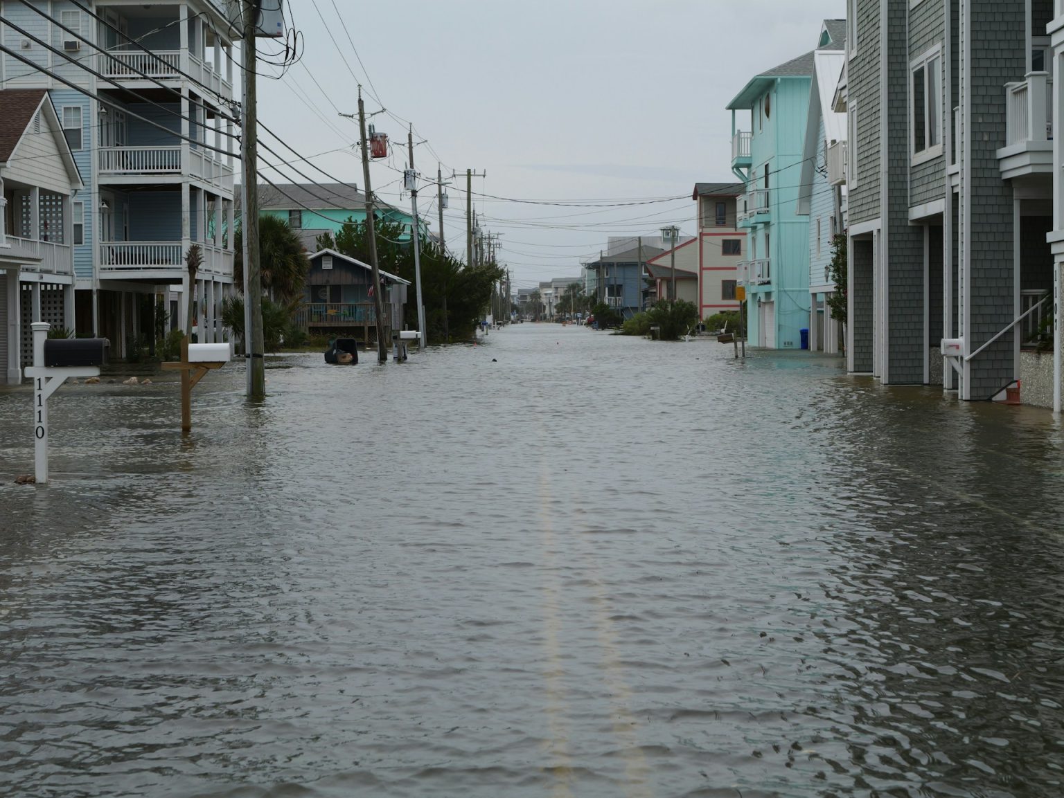Flooded residential street in Nigeria showing water accumulation and drainage challenges in urban housing areas