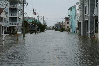 Flooded residential street in Nigeria showing water accumulation and drainage challenges in urban housing areas